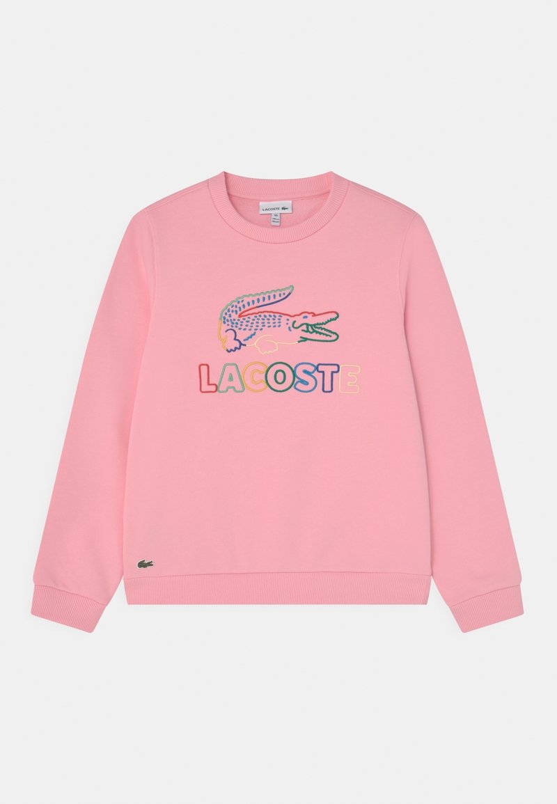 Sweatshirt rose en coton avec un col rond. Présente un logo crocodile multicolore avec le mot « LACOSTE » en dessous. Poignets côtelés.