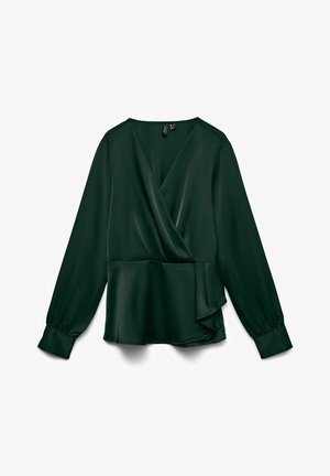 Tamsiai žalia, ilgomis rankovėmis, apvyniojama bliuskė, pagaminta iš lygaus audinio, su peplum sijonu ir šiek tiek susiraukusiomis rankovėmis. Yra V formos kaklo iškirpė ir šoninis drapavimas.