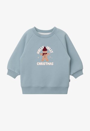 Light blue crewneck sweatshirt made of soft fabric. Features a printed gingerbread character with "Holly Jolly Christmas" text in pastel colors.