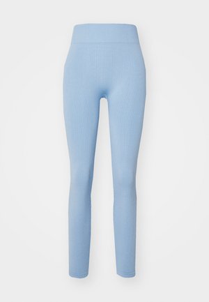 Leggings a coste blu chiaro con vita alta, design aderente e finitura senza cuciture, realizzati in un tessuto elasticizzato e testurizzato.
