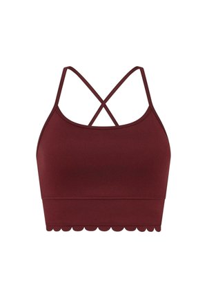 Bralette de sport bordeaux avec une texture lisse, présentant des bretelles croisées et un design à ourlet festonné.