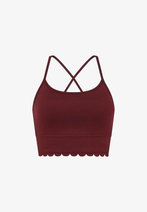 Bralette de sport bordeaux avec une texture lisse, présentant des bretelles croisées et un design à ourlet festonné.