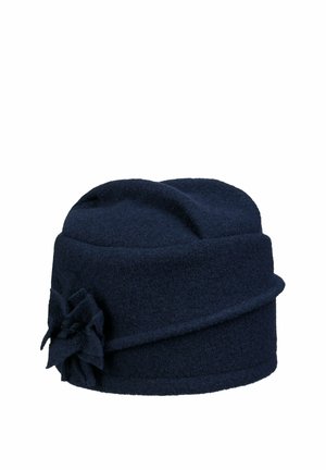 Navy blue wool cloche hat with folded detail and fabric flower embellishment on one side.