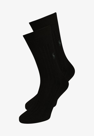 Mustad mustriga mustad puuvillased sokid, millel on soonikuga tekstuur ja väike roheline logomärk. Klassikaline meeskonna stiil mugavaks igapäevaseks kandmiseks.