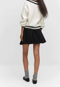 Mango Falda acampanada - black denim