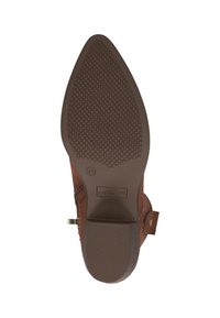 Suola di stivale in pelle marrone con una texture in gomma per la presa. Caratterizza un piccolo tacco e una punta a mandorla. Include una cerniera laterale e dettagli decorativi.