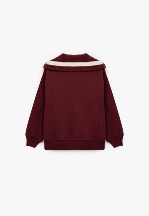 Bordeaux sweatshirt met een geribde kraag met een crèmekleurige horizontale streep, lange mouwen met geribde manchetten en een ontspannen pasvorm.