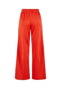 Rote weit geschnittene Hose mit elastischem Bund und glatter Textur. Sie hat eine einfarbige Gestaltung ohne Muster oder Akzente.