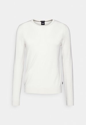 White long-sleeve sweater with a round neckline, made of smooth fabric. Features a tag on the bottom left, minimalistic design without patterns.