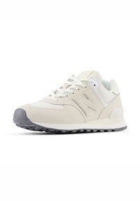 Running shoe with a beige mesh and suede upper, white accents, and a grey rubber outsole featuring a textured tread pattern.