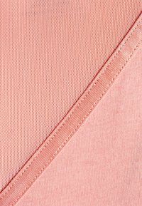 Textile in a coral hue with a smooth texture and fine horizontal stripes. Features a contrasting seam in a slightly darker tone.