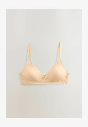 Světle béžová vycpaná podprsenka s tenkými nastavitelnými ramínky, hladkým povrchem a malou mašlí uprostřed. Jednoduchý design a podpůrný kosticový systém.