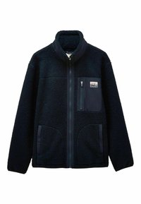 Tummansininen fleece-takki, jossa on korkea kaulus, koko etuvetoketju, yksi vetoketjullinen rintatasku logopatchilla ja kaksi sivutaskua.