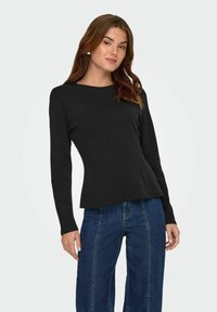 Zwarte lange mouw top met een ronde halslijn, taps toelopende taille en verticale naaddetails. De stof lijkt glad met een aansluitende pasvorm.