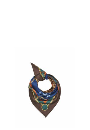 Square silk scarf with a brown, blue, and green color scheme featuring gold chain and pendant patterns, tied in a loose knot.