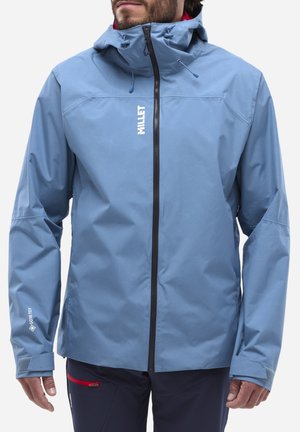 Blue waterproof jacket with a high collar, adjustable hood, and zippered front. Features include elastic cuffs and a logo on the chest.