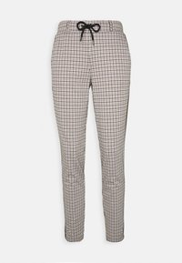 Pantalon à carreaux avec une taille à cordon, présentant un motif pied-de-poule noir et crème. Coupe slim avec des jambes fuselées. Texture lisse.