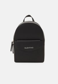 Black leather backpack with rounded top, front pocket, silver hardware, and embossed logo. Smooth texture and minimalistic design.