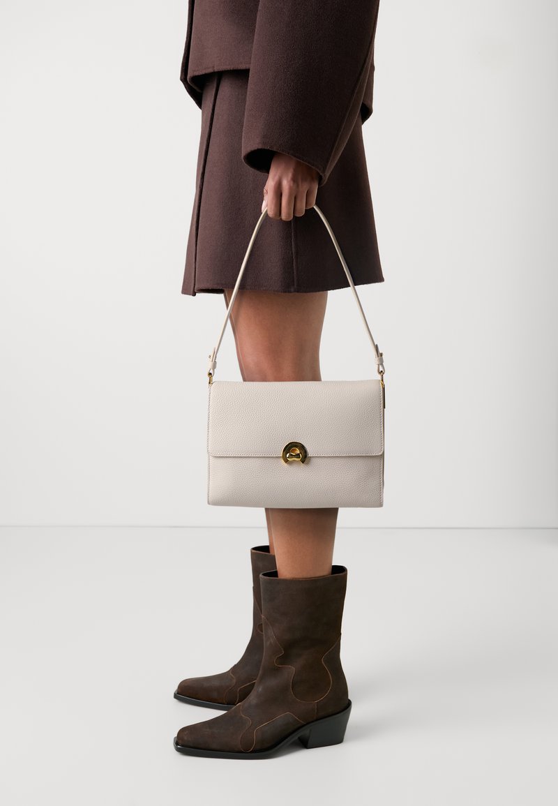 Coccinelle BINXIE - Handbag - white