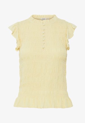 Dzeltena, teksturēta virsma ar mazām viļņotām piedurknēm, augstu kaklu un pogu plati. Tam ir frillēta apakšmala un rūpīgi savilkta auduma detaļa.