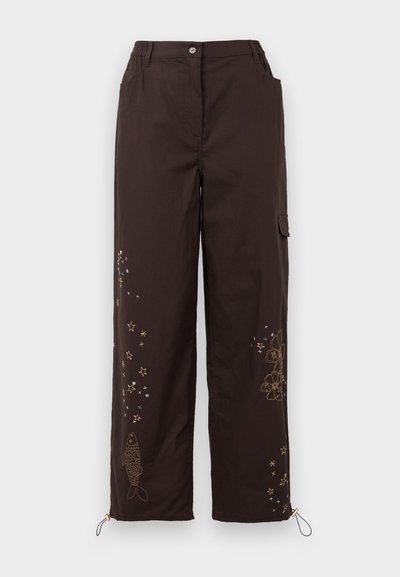 Brown wide-leg pants with embroidered star and fish designs. Features an elastic waistband, two side pockets, and adjustable ankle ties.