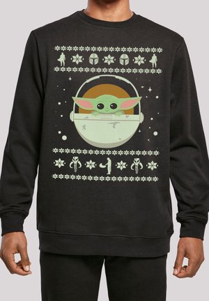 Schwarzer Sweatshirt mit grünem Baby Yoda in einer Kapsel und Star Wars-Mustern, darunter Helme und Silhouetten im Brustbereich.