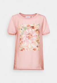 Rosa Kurzarmhemd mit Puffärmeln und großem Blumenaquarelldruck sowie kleinen goldenen Nieten in der vorderen Mitte.