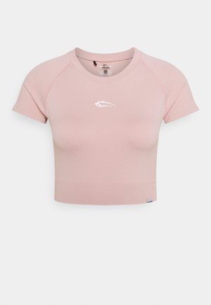 Light pink short-sleeve cropped athletic top with round neckline and small white logo centered on chest.
