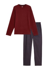 Burgundy long-sleeve top made of cotton, paired with navy patterned pajama pants featuring multicolored dots in a grid layout.