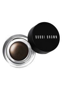 Bobbi Brown kremøyeskygge i en transparent, rund beholder. Den mørkebrune formelen har en glatt, glitrende tekstur, med et svart lokk merket "Bobbi Brown."