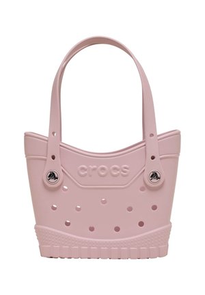 Lichtroze Crocs draagtas met geperforeerde gaatjes, twee schouderbanden en het Crocs-logo aangebracht op de voorkant.