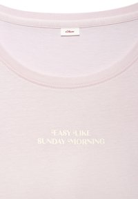 Light pink t-shirt with a round neckline, featuring embroidered text "EASY LIKE SUNDAY MORNING" in white, soft cotton fabric texture.