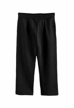 Pantalones cortos negros con cintura elástica, que presentan una textura suave y un corte holgado, ideales para un uso casual.