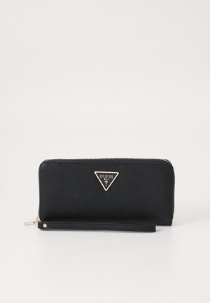 Black zip-around wallet with textured surface, gold triangular logo, and wrist strap. Features smooth hardware and a compact design.