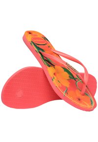 Chinelos rosa com padrão floral em laranja e verde. Feitos de borracha, apresentam uma sola texturizada e tiras finas. A vista superior mostra os detalhes do design.