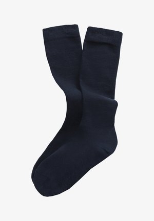 Calcetines de algodón azul marino, de longitud media hasta la pantorrilla, con una textura suave y puño acanalado. Sin patrones visibles ni adornos.