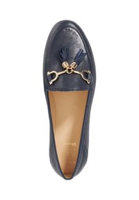 Navy leather loafers featuring a gold hardware accent with tassels, smooth texture, and a rounded toe design. Inner lining has branding detail.