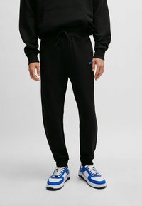 HUGO - Tracksuit bottoms - black one Thumbnail Image 1