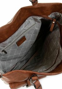 Sac à main en cuir marron avec intérieur en tissu gris à motifs, doté d'une poche zippée et de plusieurs compartiments à l'intérieur.