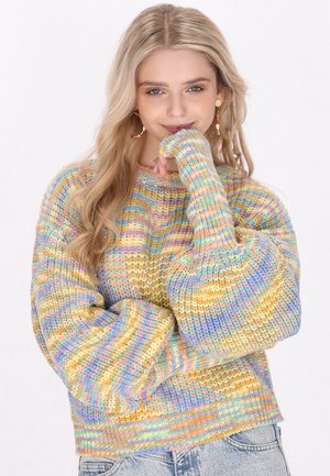 Suéter de punto multicolor con rayas en tonos pastel de amarillo, rosa, azul y lavanda. Con escote redondo y mangas abullonadas de corte oversize.