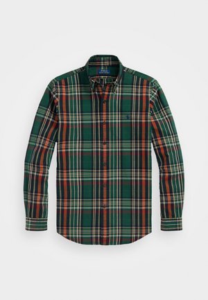 Chemise à carreaux verts avec des rayures orange, marine et blanches. Dotée d'un col classique et de manches longues, fabriquée en coton doux.