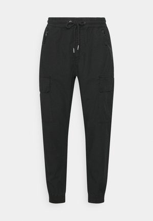 Svarta cargobyxor med elastisk midja, justerbar dragsko, sidofickor med dragkedja och avsmalnande ben. Tillverkade av hållbart tyg med matt finish.