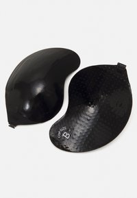 Black padded bra inserts shaped like crescent moons, featuring a smooth outer surface and textured interior, labeled with "Cup Size B."