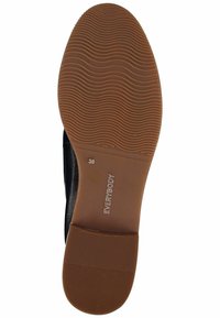 Semelle de chaussure noire avec un design texturé, comprenant une base en caoutchouc marron lisse et le nom de la marque "EVERYBODY" en relief. Taille indiquée comme 36.