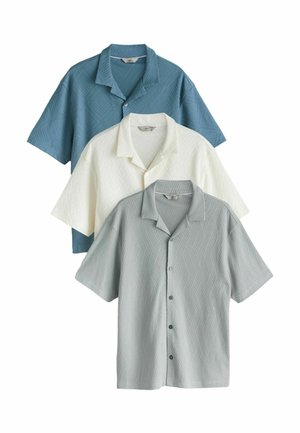 Three short-sleeve button-up shirts with collars in blue, white, and gray, featuring a subtle textured geometric pattern.
