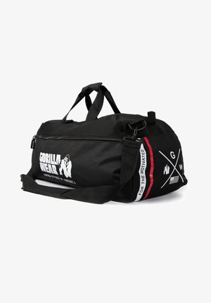 Borsa da palestra nera realizzata in tessuto resistente, dotata di chiusura con zip, doppi manici e una tracolla removibile con logo e dettagli.