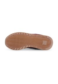 Shoe sole with a textured pattern; rubber material in light brown featuring zigzag grooves for improved grip and traction.