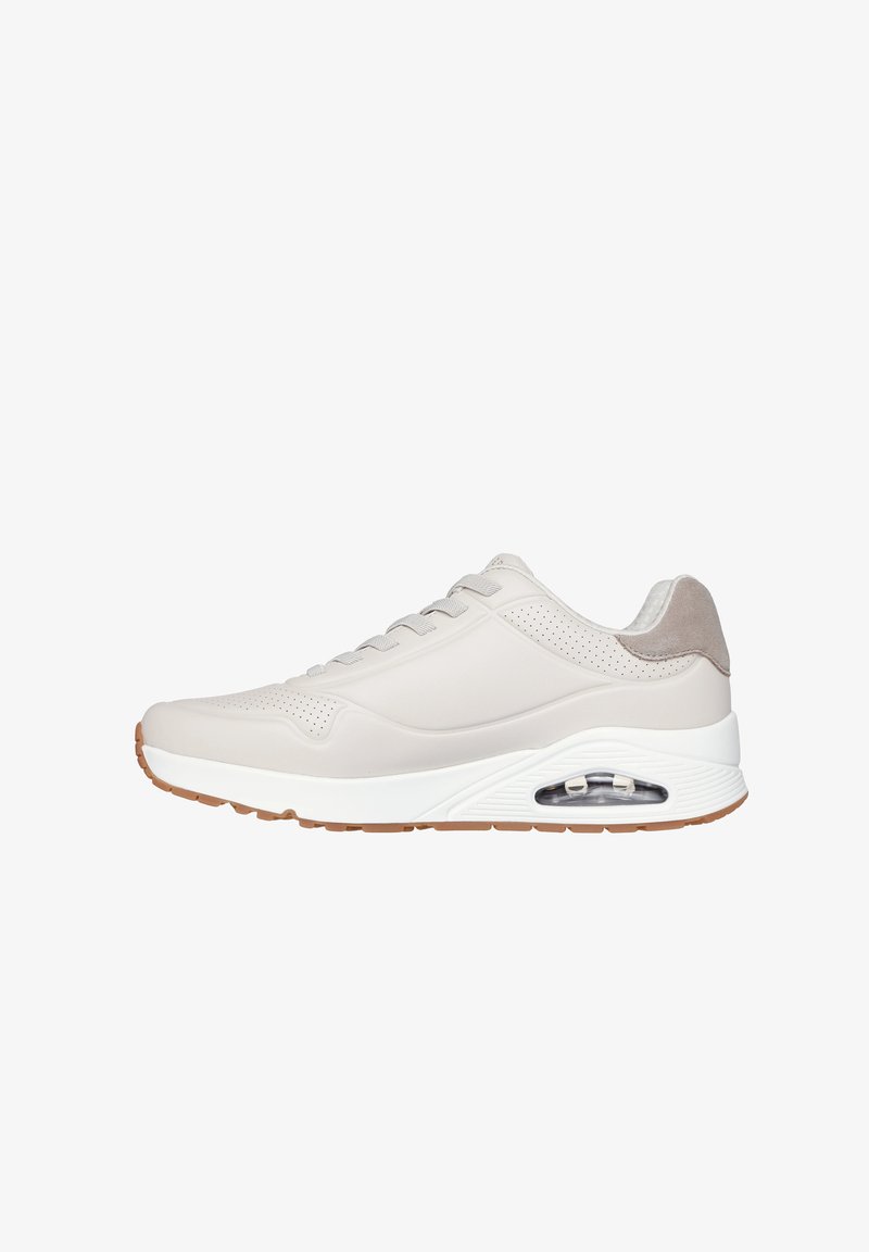 Light gray athletic sneaker with perforated details, lace-up front, cushioned sole with visible air cushion, and gum rubber outsole.