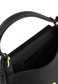 Black textured leather handbag with a single handle, gold hardware, and an open top showing an interior zippered pocket.