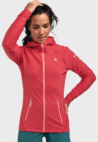 Roter Reißverschluss-Hoodie mit strukturiertem Muster, verstellbare Kapuze und zwei Fronttaschen, ausgestattet mit kontrastierenden hellrosa Reißverschlüssen.